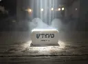 Artistic product shot of V TEVO ceramic coating sponge illuminated with dramatic lighting.